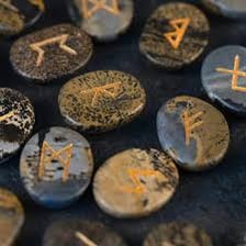 Runic symbols carved into a stone surface.