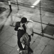 A couple kissing in a London street.