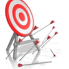An arrow that has missed the center of an archery target.
