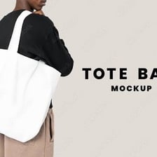 A person carrying a full tote bag.