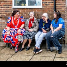 A group of people dressed and posed in noticeably quirky ways.