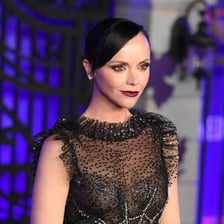 A portrait of actor Christina Ricci associated with Wednesday Addams.