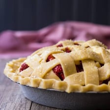 A pie topped with a crisscross lattice crust