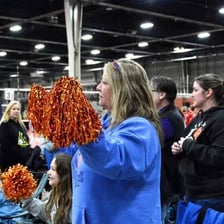A coach encouraging an athlete during a competition.