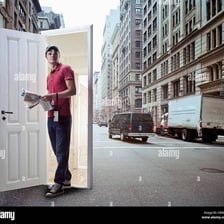 A person emerging from a doorway