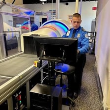 A Transportation Security Administration checkpoint screening travelers and bags.