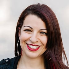 A portrait of Anita Sarkeesian, founder of Feminist Frequency.