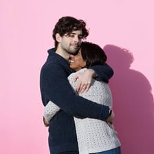 Two close friends embracing affectionately.