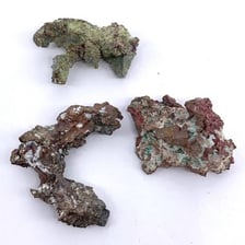 A rock specimen containing visible metal-bearing ore
