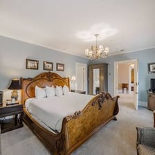 A guest room at a bed-and-breakfast, furnished with a bed.