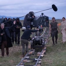Christopher Nolan directing a film on a movie set.