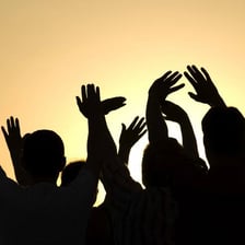 A person waving goodbye