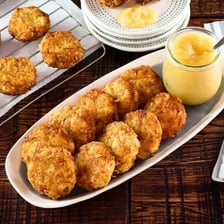 Potato latke displayed beside french fries