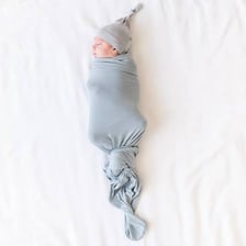 A baby wrapped tightly in a swaddling cloth