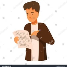 A person smiling while solving a crossword puzzle.