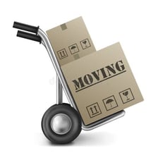 Moving boxes and household items prepared for relocation.