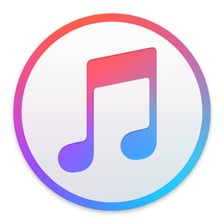 The iTunes logo displayed with a digital music library.