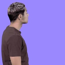 A person reacting with surprise while greeting someone