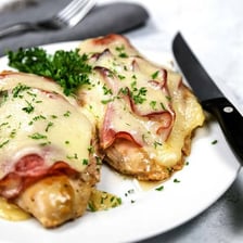 A sliced chicken cordon bleu showing its ham and cheese filling