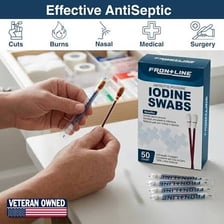 Brown iodine antiseptic solution being applied with a cotton swab