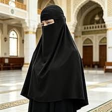 A woman wearing a niqab that covers the face below the eyes