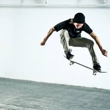 Skateboarder and board airborne during an ollie
