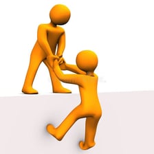 One person assisting another person to stand.