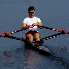 A sculling boat equipped with an oar.