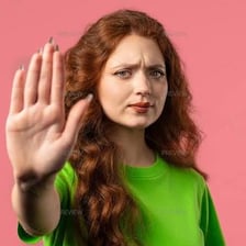 A person showing disapproval with a raised finger