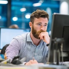 A person working at a desk in an office job.