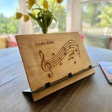 A visual pairing of a sheet of metal and a sheet of musical notation.