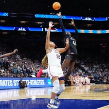 A women’s college basketball game played under NCAA competition.