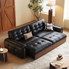 A remote control resting on a living room sofa