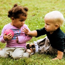 Children indicating who gets first choice of an object.