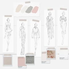 A fashion designer sketches clothing designs on paper.