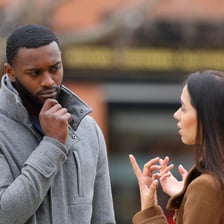 Two people in a tense conversation, with one accusing the other of lying.
