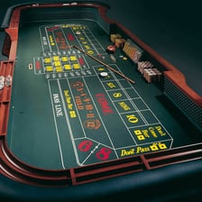 Dice being rolled on a craps table