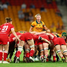 Rugby players packed together in a scrum