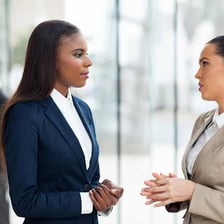 A sales representative discussing a product with a customer.
