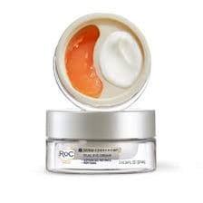 A container of eye cream beside skincare products.