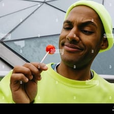 A person reacting with a small amused smile