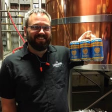 Illustration of an ordinary working man holding a six-pack of beer