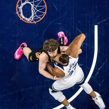 Professional basketball players competing in an NBA game