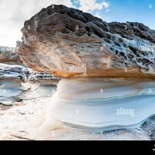 A rock formation visibly shaped by erosion