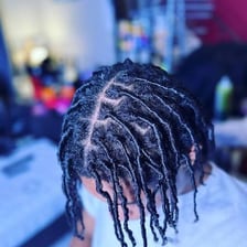 Comb coils being used to start a locs hairstyle