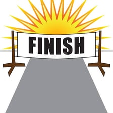 A runner reaching a finish line.