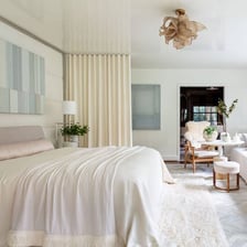 A made bed in a bedroom