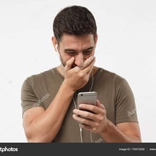 Person laughing while reading a text message