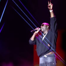 Singer Akon performing on stage.