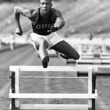 Jesse Owens competing in a 1936 Olympic track event